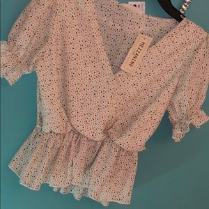 Blouse in white and poka dots